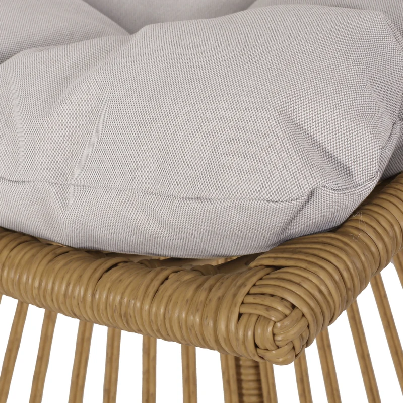 Wicker outdoor chair and side table set with cushions; light brown and beige