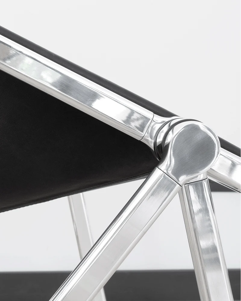 Chaise pliante en cuir noir et acier chromé Plona - Anonima Castelli