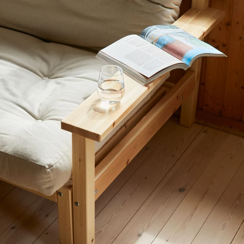 Canapé-lit en pin massif avec accoudoirs et matelas en coton marron 130x190cm Unwind - Karup Design