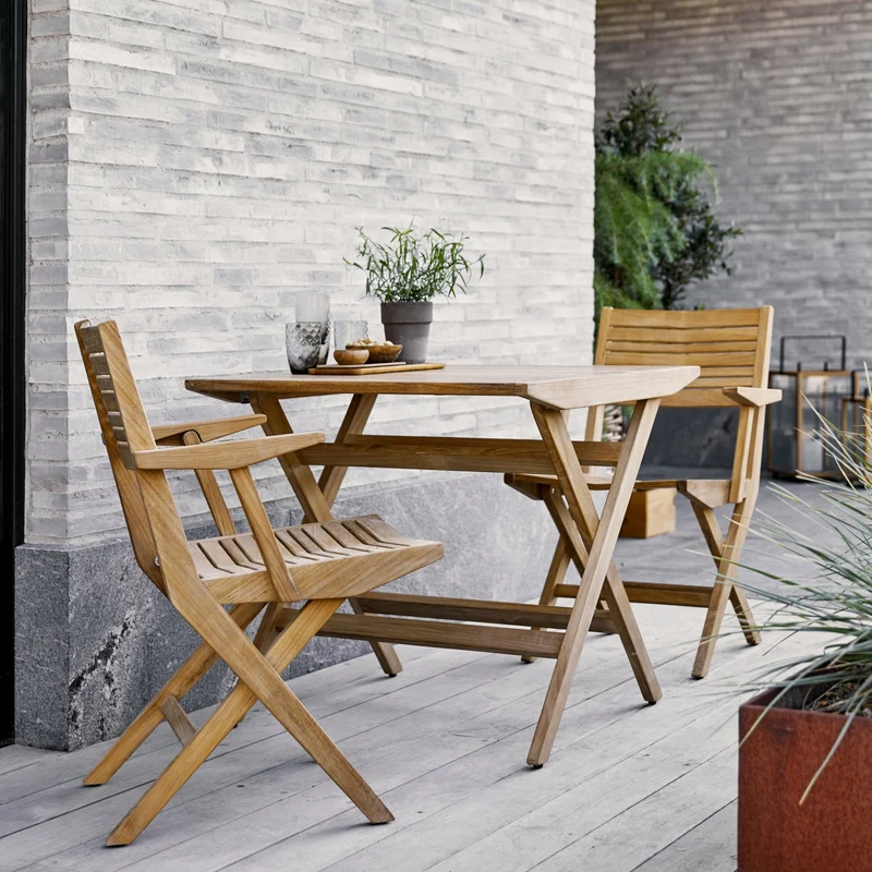 Chaise de jardin avec accoudoirs pliable en teck Flip - Cane-Line