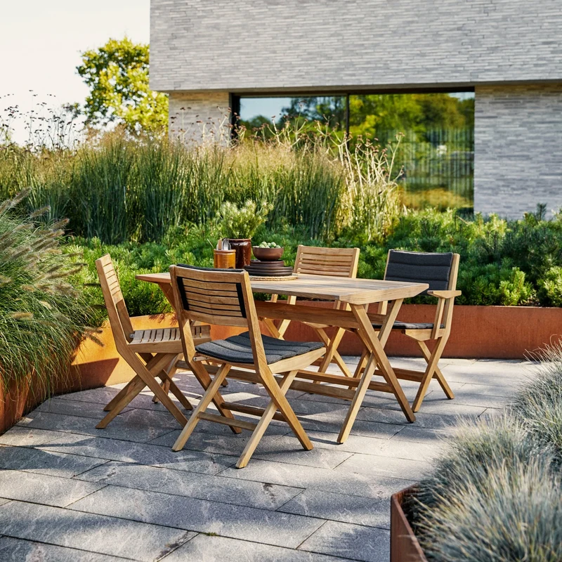 Chaise de jardin avec accoudoirs pliable en teck Flip - Cane-Line