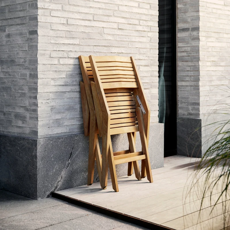 Chaise de jardin avec accoudoirs pliable en teck Flip - Cane-Line